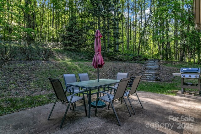 385 N Fork Rd, Black Mountain, NC 28711 - view of patio featuring grilling area, stairway, and outdoor dining space