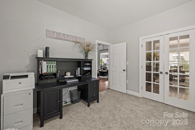 office area featuring french doors, light carpet, and baseboards