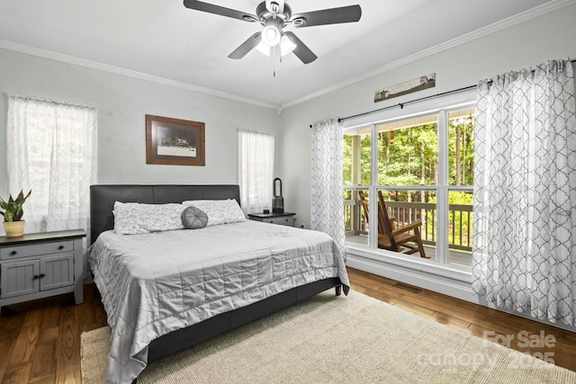 bedroom featuring crown molding, wood finished floors, and a ceiling fan