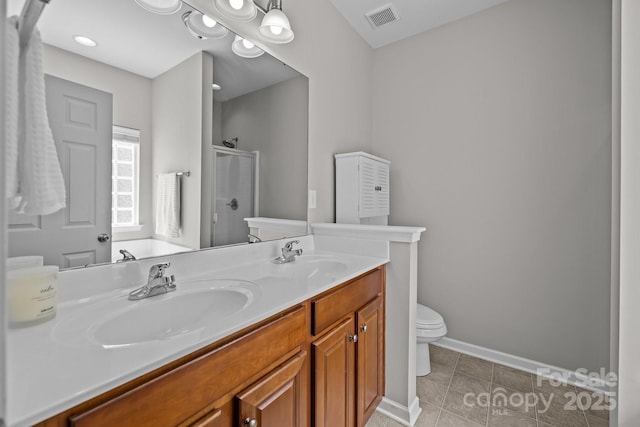 full bath featuring a sink, tile patterned floors, a shower stall, and visible vents
