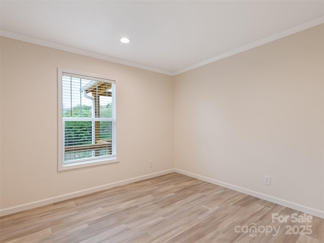 unfurnished room featuring crown molding, recessed lighting, baseboards, and light wood-style floors