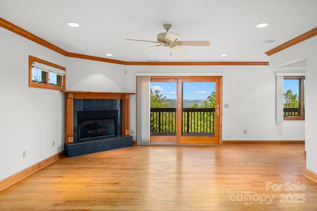 117 Distant View Dr, Asheville, NC 28803 - unfurnished living room featuring ornamental molding, light wood-style floors, baseboards, recessed lighting, and a fireplace with raised hearth