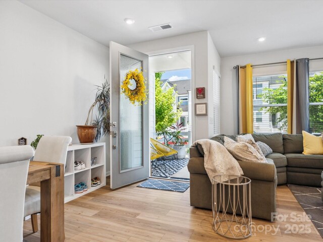 entryway with recessed lighting, visible vents, and wood finished floors
