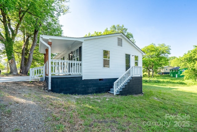 1411 Caldwell St, Gastonia, NC 28052 - view of home's exterior featuring covered porch, a yard, and crawl space