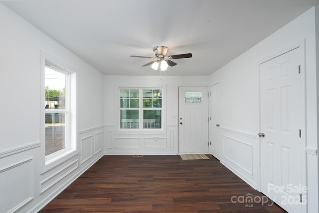1411 Caldwell St, Gastonia, NC 28052 - doorway with wainscoting, a ceiling fan, and dark wood-style flooring