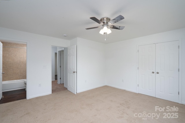 1411 Caldwell St, Gastonia, NC 28052 - unfurnished bedroom with a ceiling fan, baseboards, a closet, carpet flooring, and ensuite bath