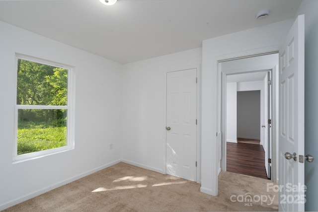 1411 Caldwell St, Gastonia, NC 28052 - unfurnished bedroom featuring baseboards and carpet