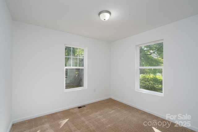 1411 Caldwell St, Gastonia, NC 28052 - carpeted empty room featuring baseboards and visible vents