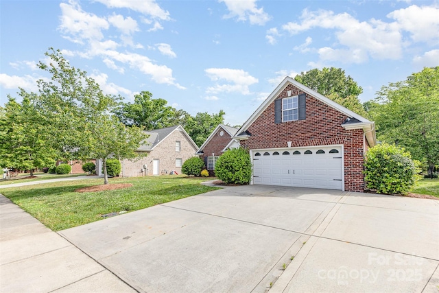 traditional home featuring brick siding, driveway, and a front yard
