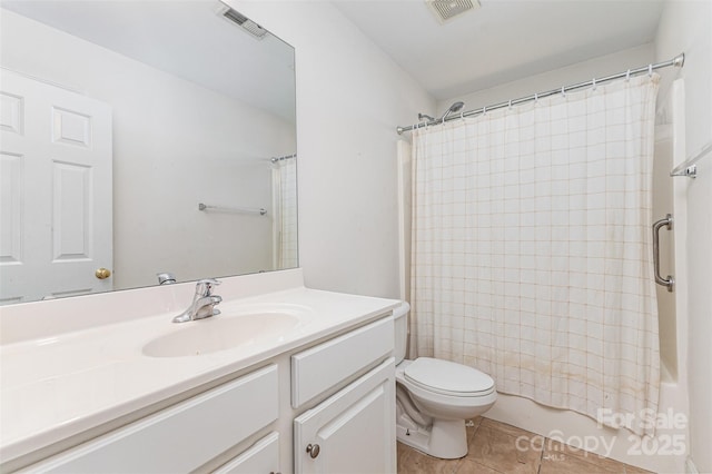 full bathroom featuring tile patterned flooring, toilet, vanity, and shower / bathtub combination with curtain