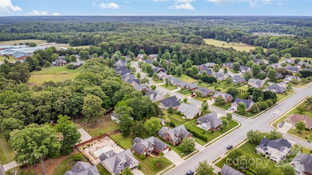 aerial perspective of suburban area featuring a forest