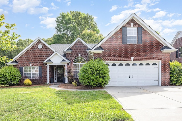 traditional-style house featuring brick siding, concrete driveway, a front lawn, and an attached garage