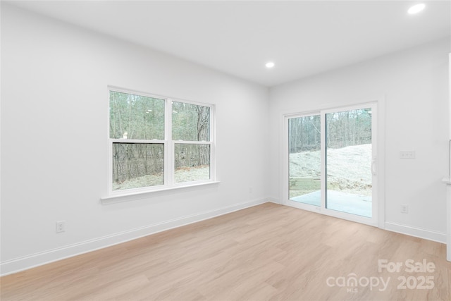 2815 New Pineola Rd, Charlotte, NC 28208 - unfurnished room with recessed lighting, baseboards, and light wood finished floors