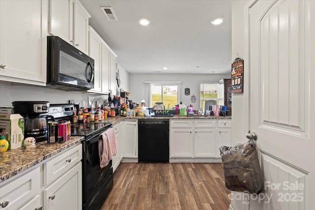 1270 Winding Creek Rd, Salisbury, NC 28146 - kitchen featuring black appliances, white cabinetry, dark wood-style floors, recessed lighting, and light stone counters