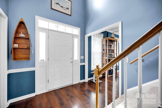 entrance foyer featuring dark wood-style floors and baseboards
