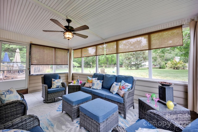 sunroom featuring ceiling fan and an outdoor hangout area