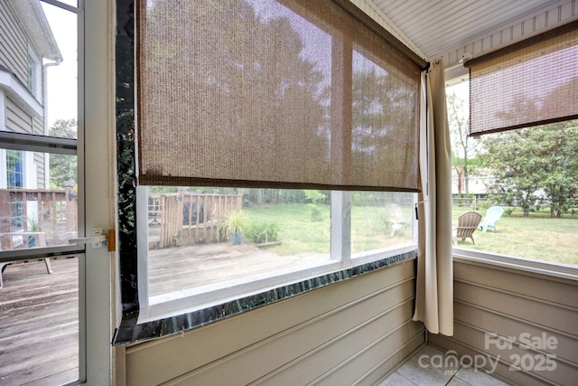 unfurnished sunroom featuring tile patterned floors