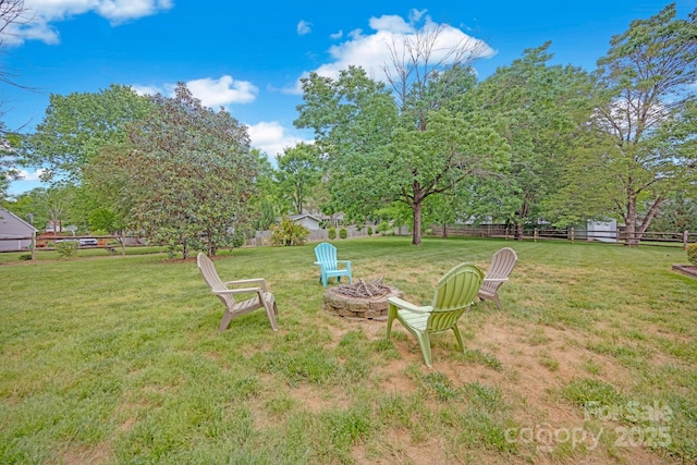 view of yard with a fire pit