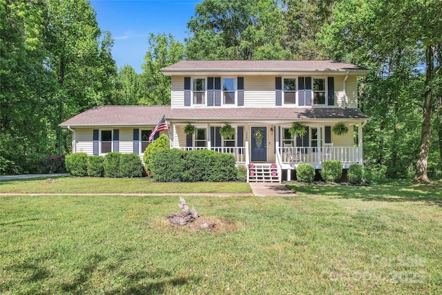 view of front facade with a porch and a front yard