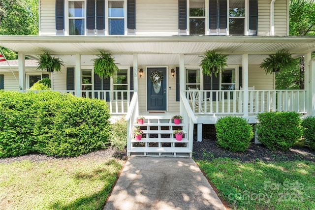 view of exterior entry featuring a porch