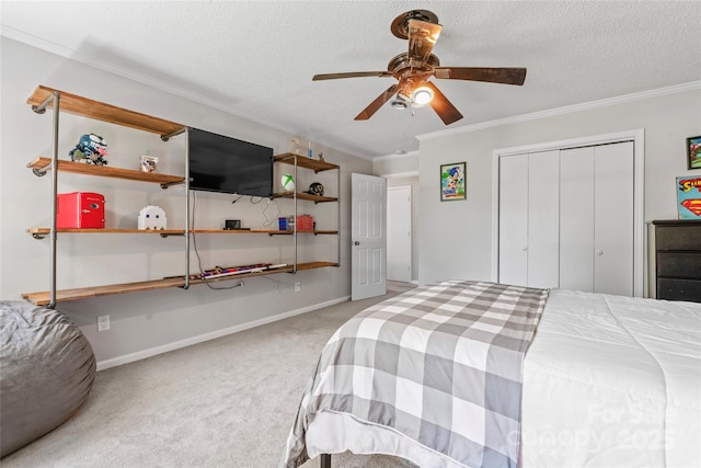 bedroom with ornamental molding, carpet, and a textured ceiling