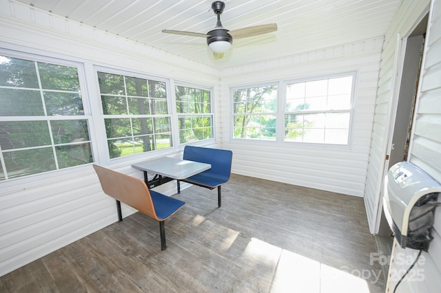 sunroom featuring a healthy amount of sunlight and wood finished floors
