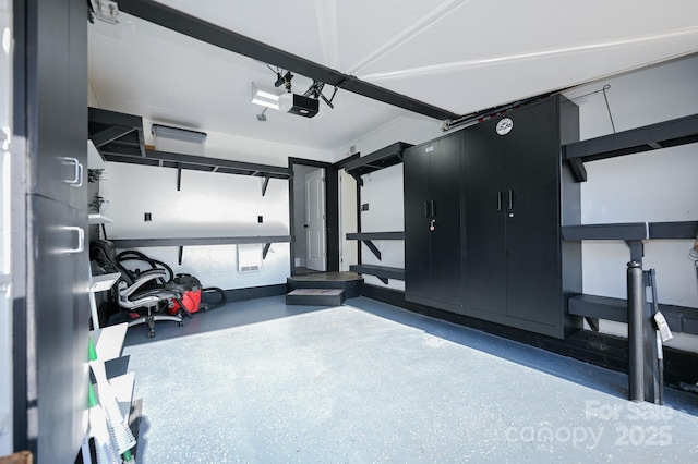 garage featuring a garage door opener