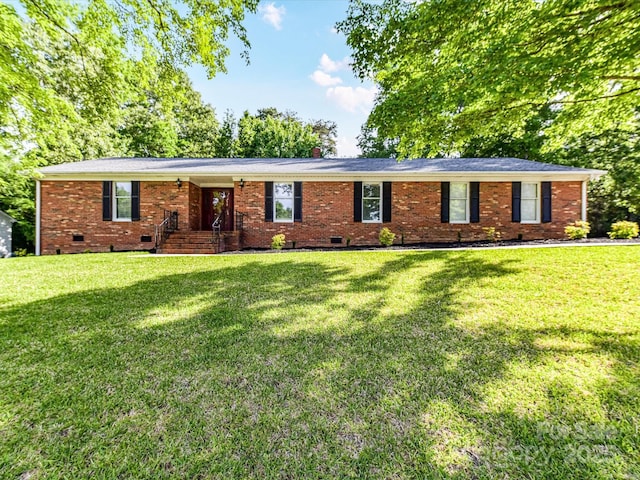 single story home featuring crawl space, a front lawn, and brick siding
