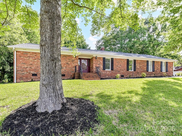 single story home with crawl space, brick siding, and a front yard