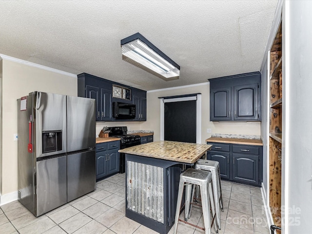 kitchen with stainless steel fridge with ice dispenser, black microwave, light countertops, crown molding, and blue cabinetry