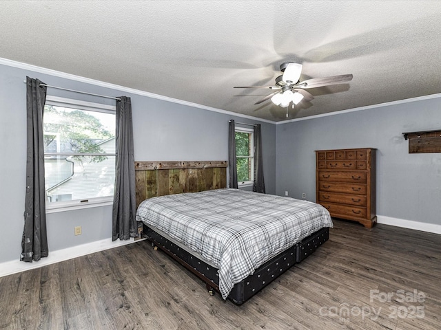 bedroom with wood finished floors, a textured ceiling, crown molding, a ceiling fan, and baseboards