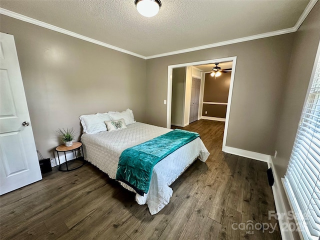 70 Cumberland Ct SW, Concord, NC 28025 - bedroom with dark wood-style flooring, a textured ceiling, ornamental molding, and baseboards