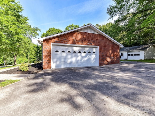70 Cumberland Ct SW, Concord, NC 28025 - view of side of home with brick siding and an outbuilding