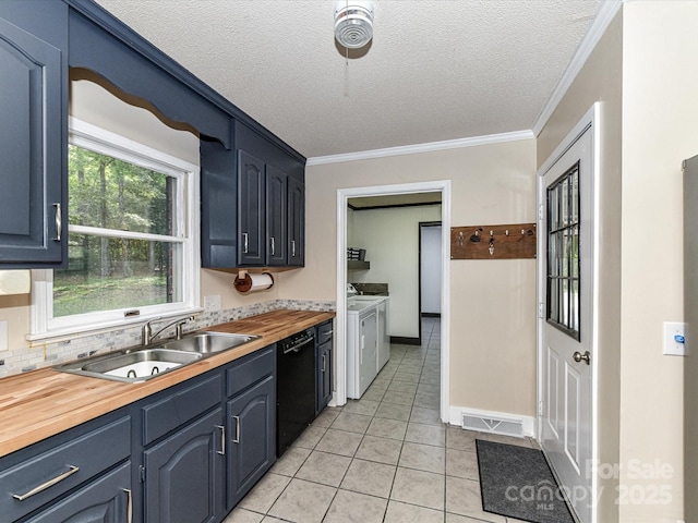 70 Cumberland Ct SW, Concord, NC 28025 - kitchen featuring washing machine and dryer, a sink, black dishwasher, wood counters, and crown molding