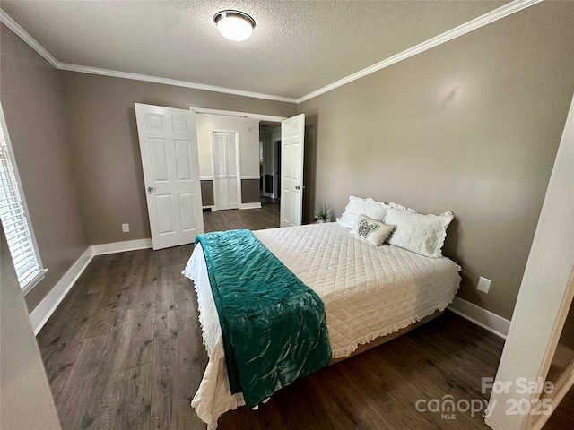 70 Cumberland Ct SW, Concord, NC 28025 - bedroom with dark wood finished floors, ornamental molding, a textured ceiling, and baseboards