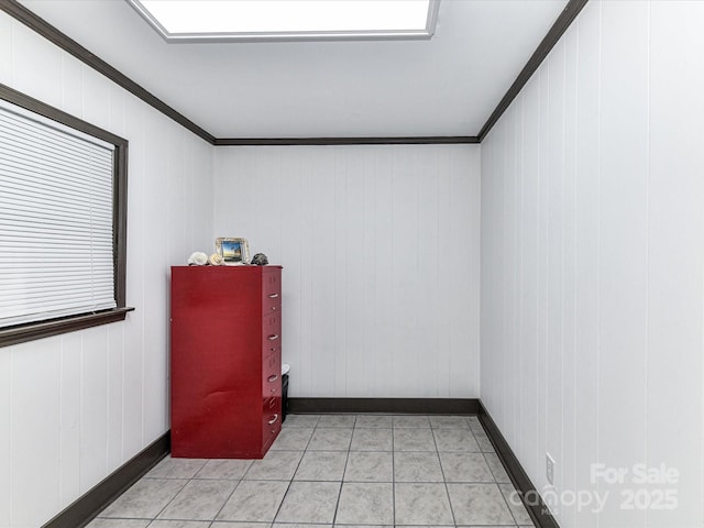 70 Cumberland Ct SW, Concord, NC 28025 - spare room featuring ornamental molding, baseboards, and light tile patterned floors