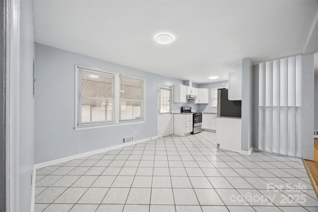 3828 Delgany Dr, Charlotte, NC 28215 - unfurnished living room featuring light tile patterned flooring and baseboards