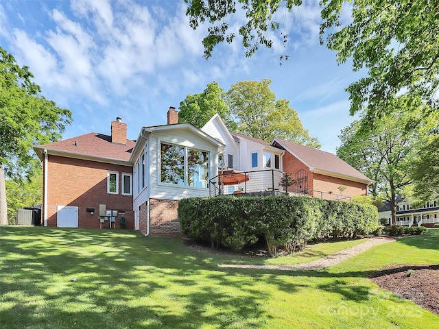 4509 Rosecliff Dr, Charlotte, NC 28277 - back of house with brick siding, a chimney, a yard, and central AC unit