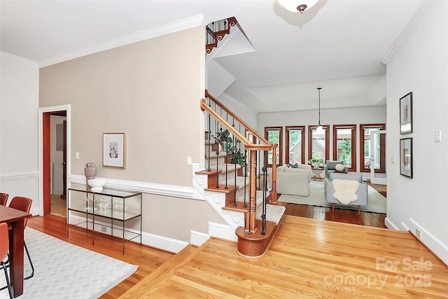 4509 Rosecliff Dr, Charlotte, NC 28277 - stairway with wood finished floors, ornamental molding, and baseboards