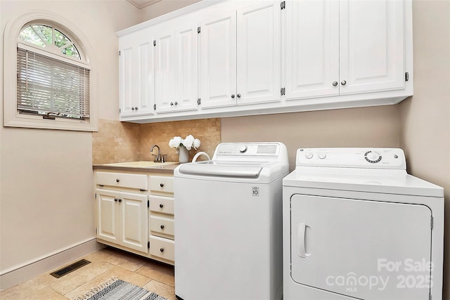 4509 Rosecliff Dr, Charlotte, NC 28277 - laundry area with washing machine and clothes dryer, cabinet space, and baseboards