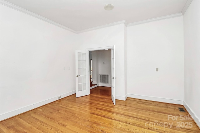 4509 Rosecliff Dr, Charlotte, NC 28277 - empty room featuring ornamental molding, french doors, light wood-style floors, and baseboards