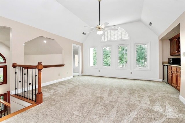 4509 Rosecliff Dr, Charlotte, NC 28277 - unfurnished living room with vaulted ceiling, a ceiling fan, light colored carpet, and baseboards