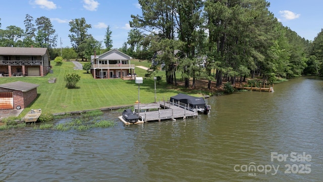dock with a water view and a lawn
