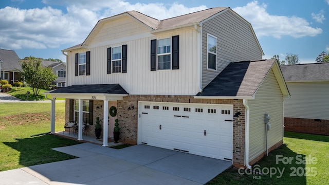 view of front facade with brick siding, a garage, board and batten siding, a front yard, and driveway