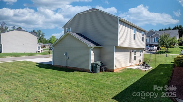 exterior space with a yard and a patio area