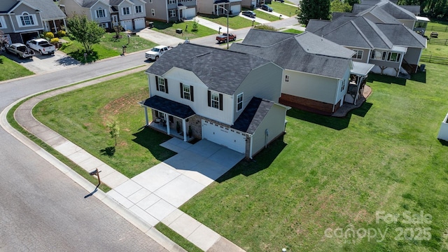 birds eye view of property with a residential view