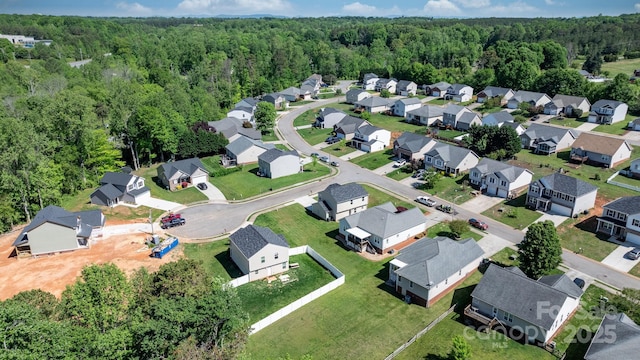 aerial view with a forest view and a residential view