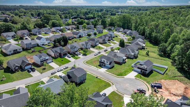aerial view with a residential view and a wooded view