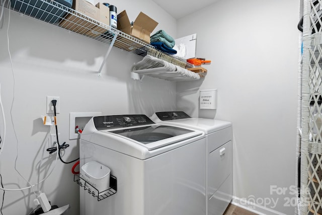 laundry room with laundry area and washing machine and clothes dryer