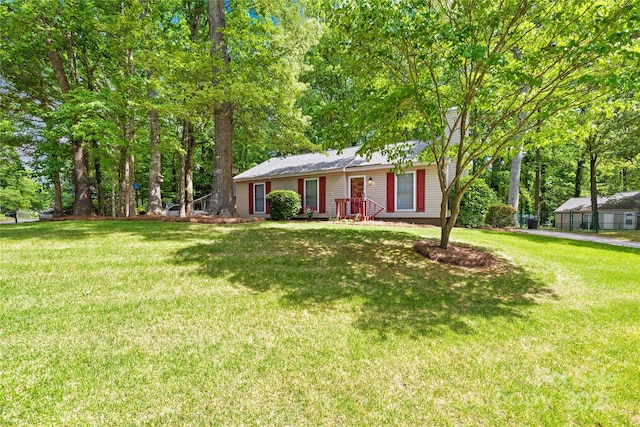 ranch-style home featuring a front yard